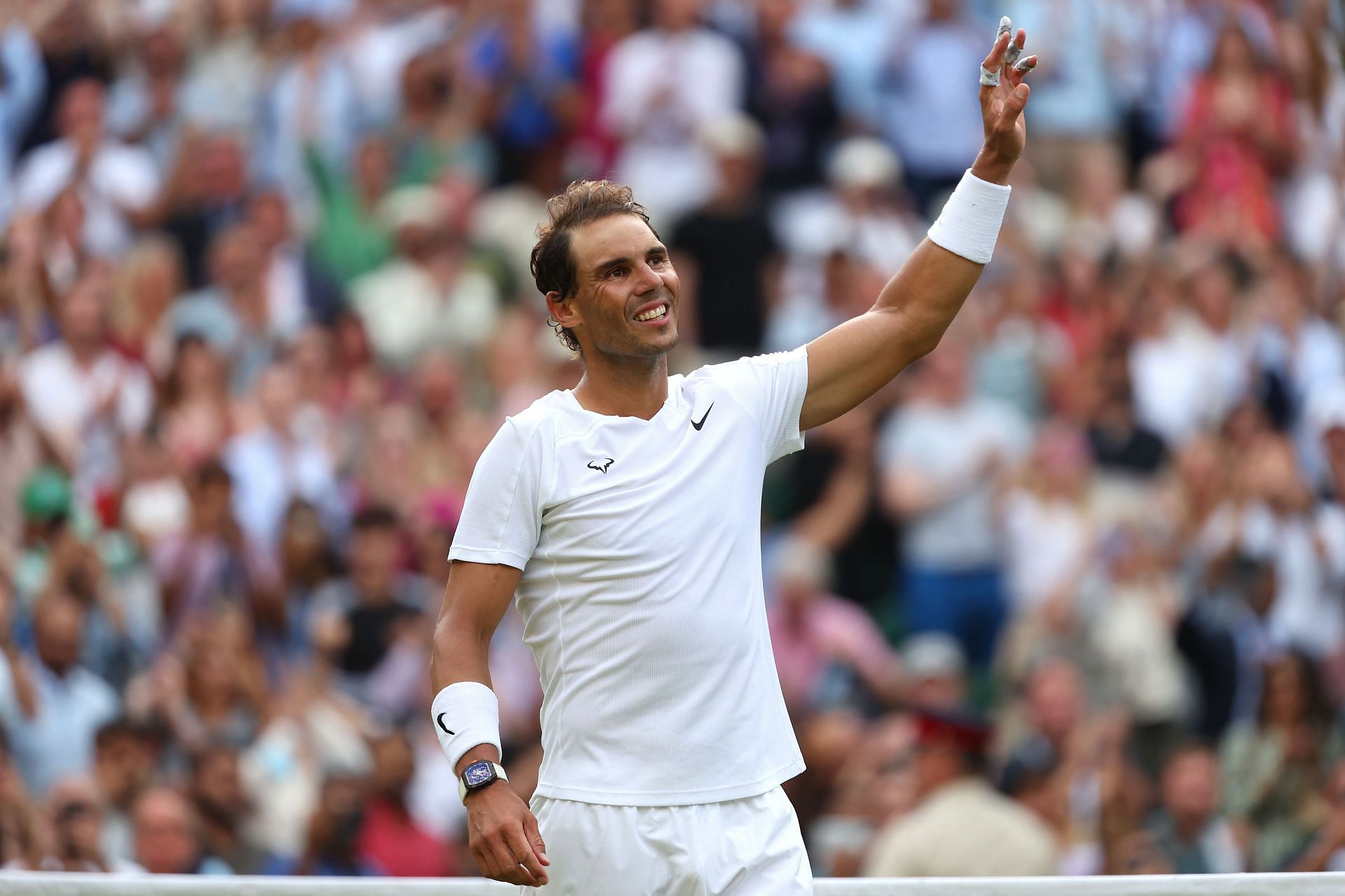 Nadal waves to the crowd after his epic win against Taylor Fritz